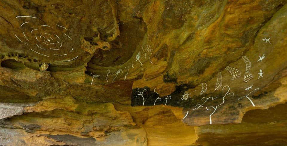 Cave murals by artist Rachael Lafferty at Wanderlust Retreat campsite