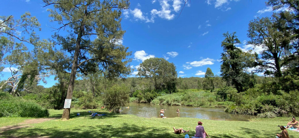 Camping area at Bigriggen Park with scenic mountain backdrop in Scenic Rim, Queensland