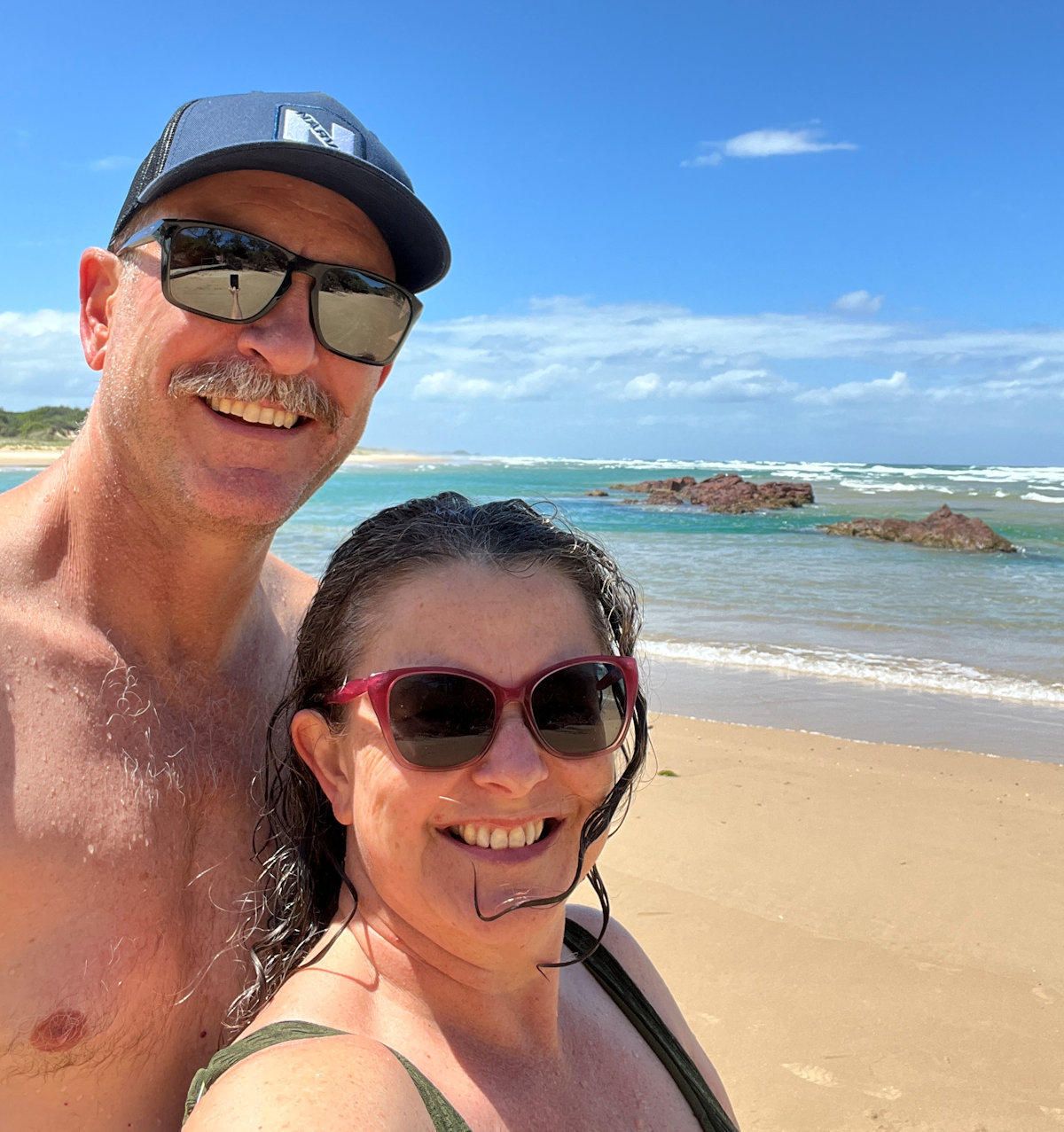 Sandy shoreline and rocky headland at Little Beach, Red Rock NSW