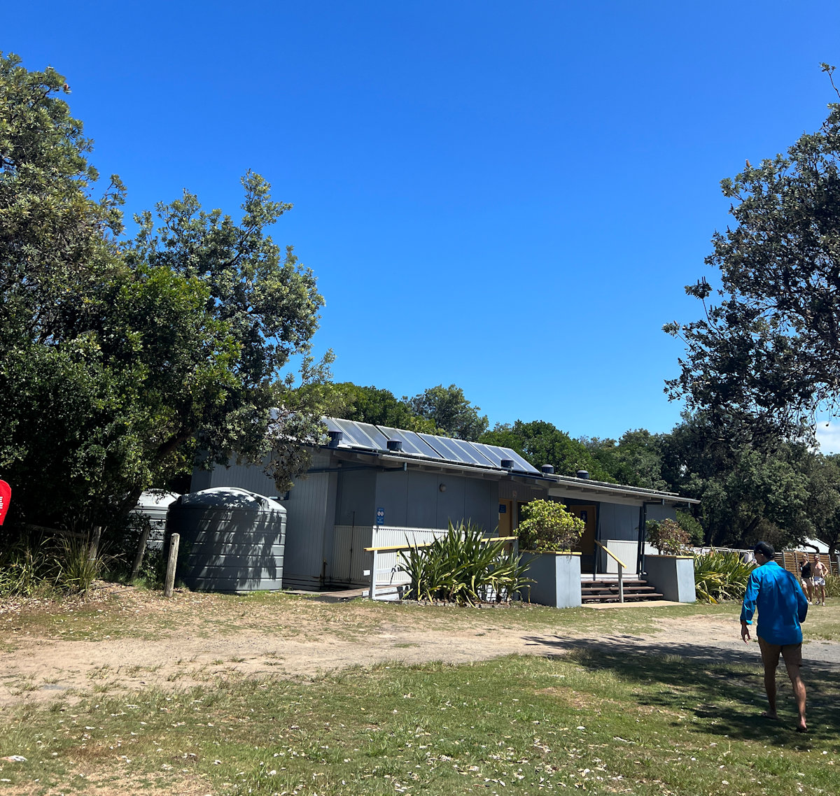Grassy camping grounds with facilities at Reflections Holiday Parks, Red Rock NSW