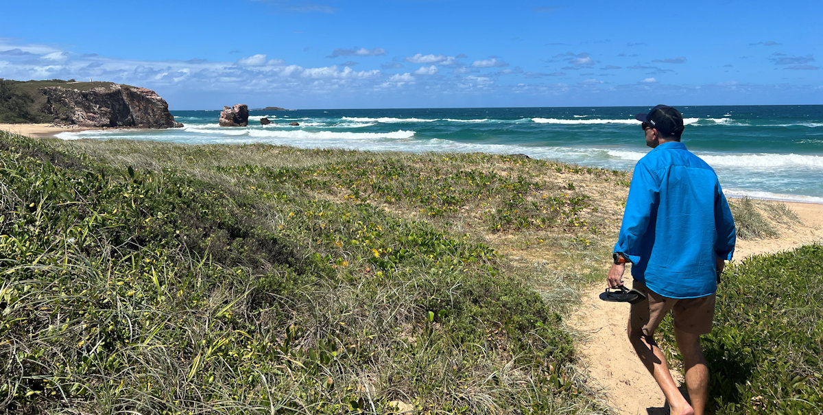 Wide sandy Main Beach with gentle waves at Red Rock NSW