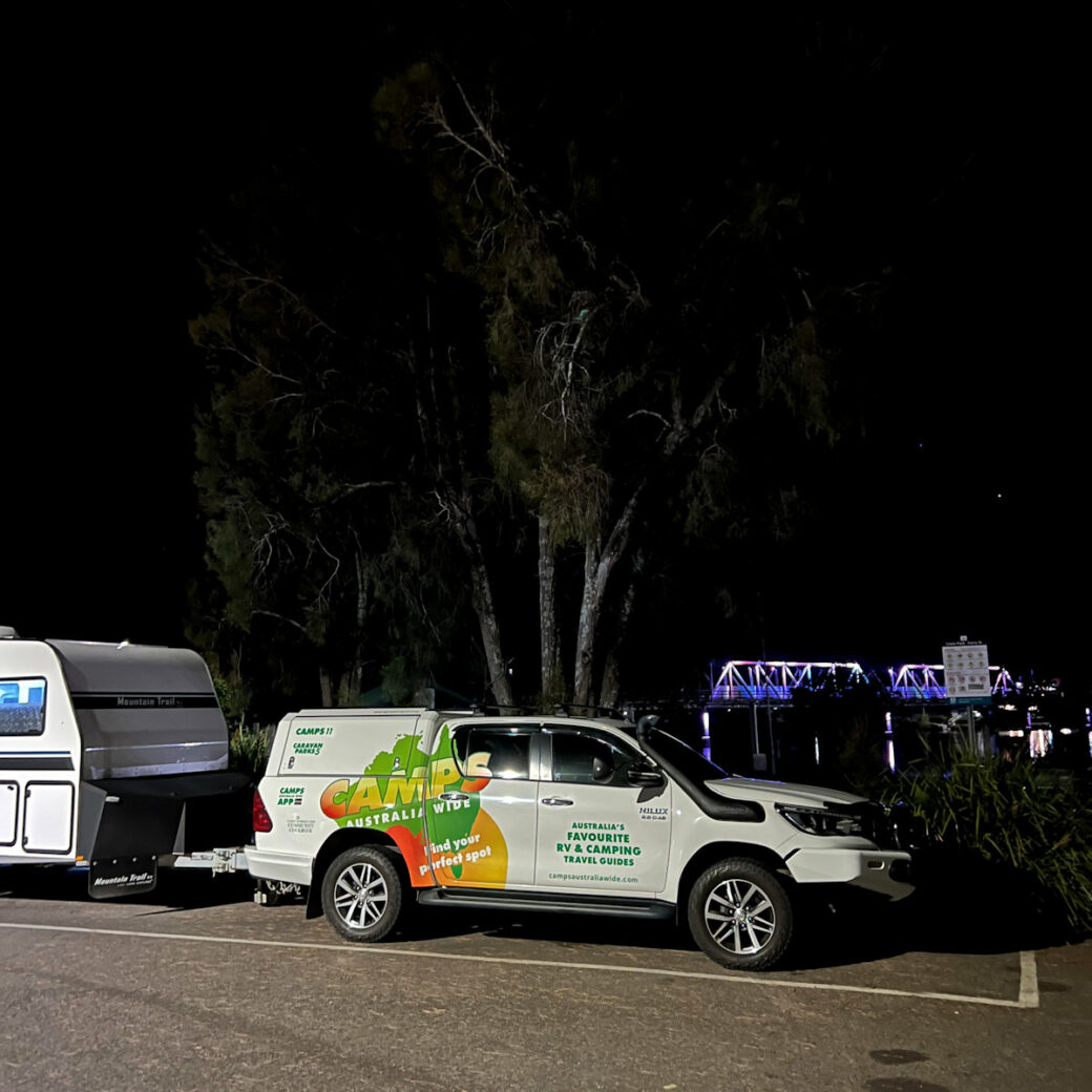 Camping area with green grass and trees at Macksville campground, NSW