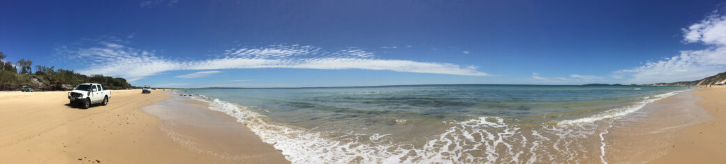 Scenic coastal view of Rainbow Beach in Queensland with golden sand and turquoise waters