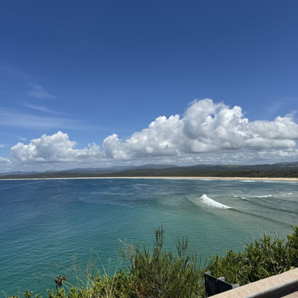 Scenic view of Merimbula Bay near Bar Beach with rocky headland and clear blue water