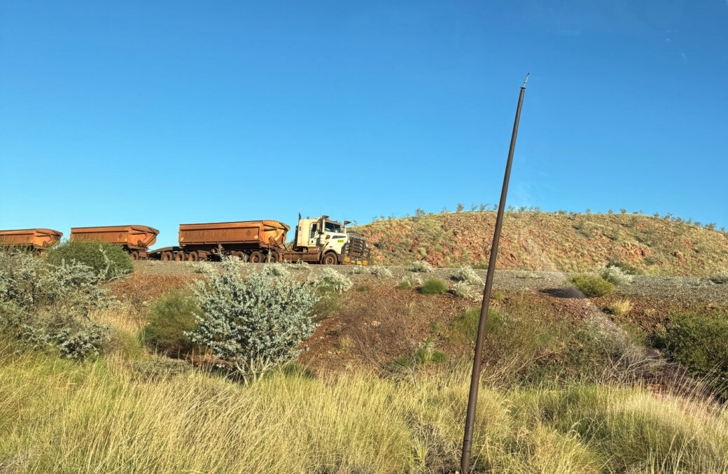 Road trains travelling through Marble Bar in outback Western Australia