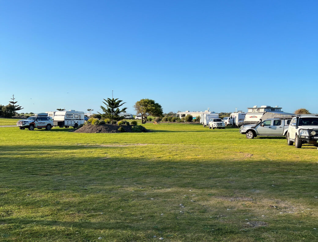 RV and caravans parked at Kingston SE Jetty Parking Area with coastal views