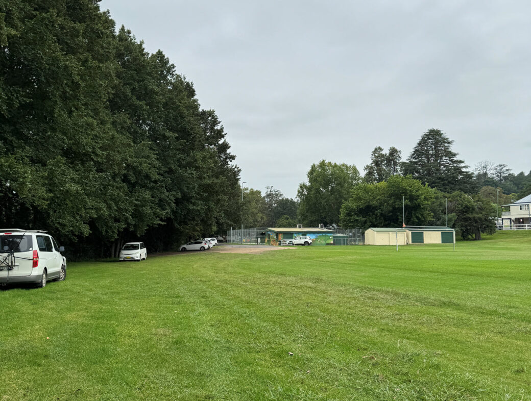 Caravans and campers set up on grass at William Loftus Park, Candelo