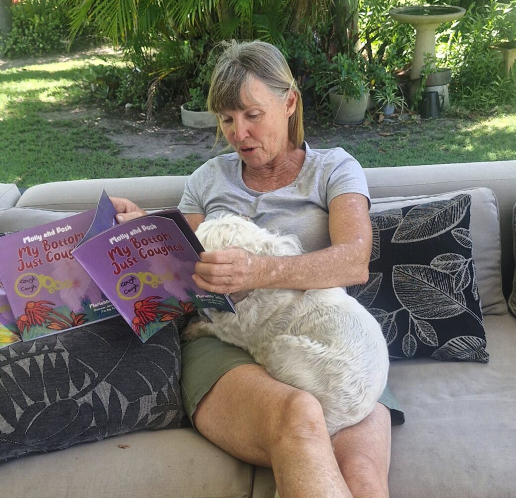 Marianne reading her children's book to Molly, the adventure dog who inspired the story